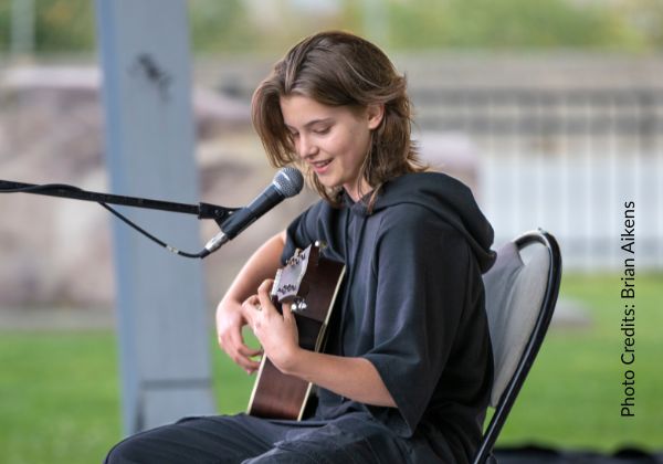 A student performing at a singing studio recital in Squamish
